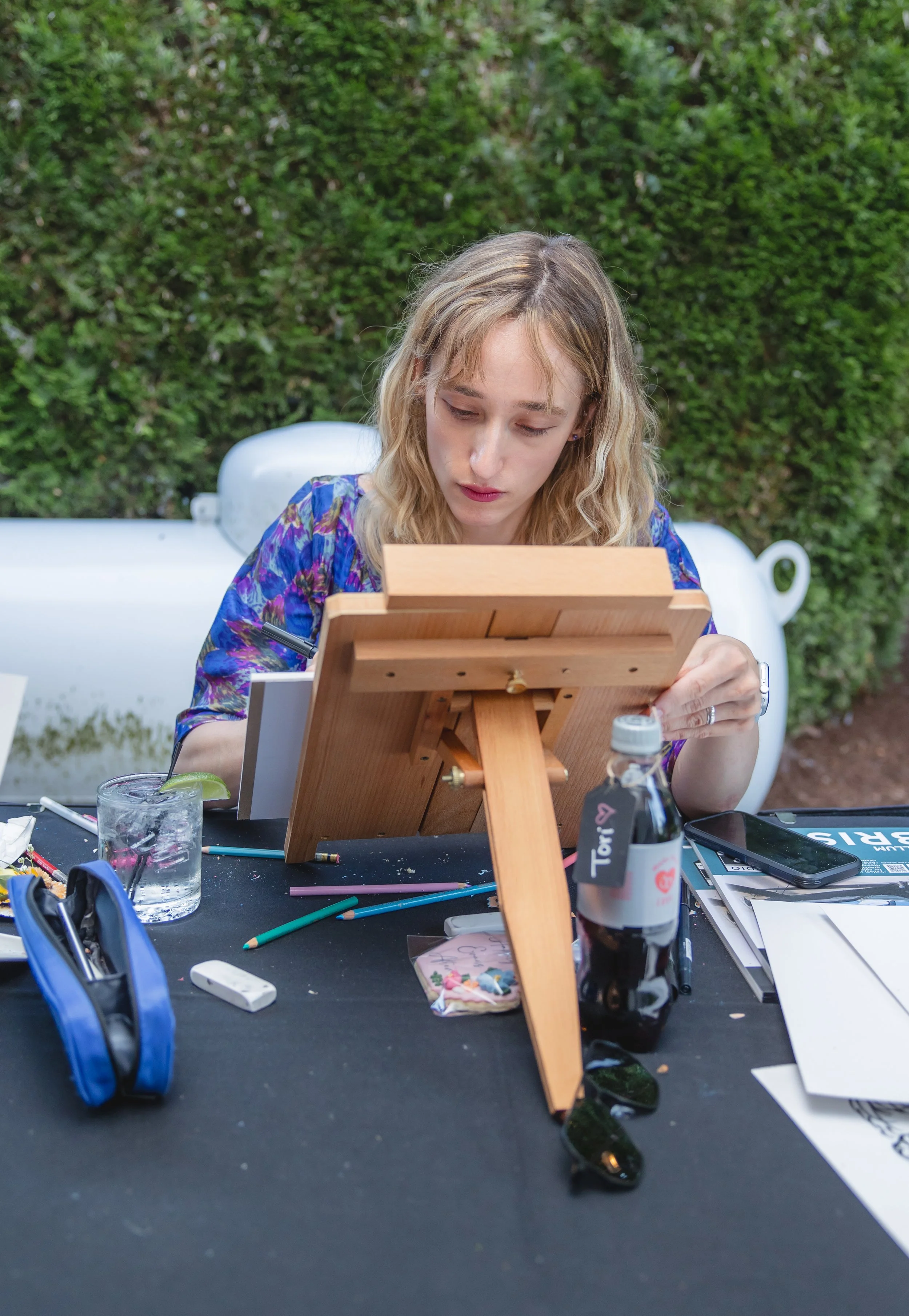 Live portrait and wedding and event artist working a wedding in Portland, Oregon. Pacific Northwest, Washington. LGBT Bisexual Lesbian Sapphic WLW artist.