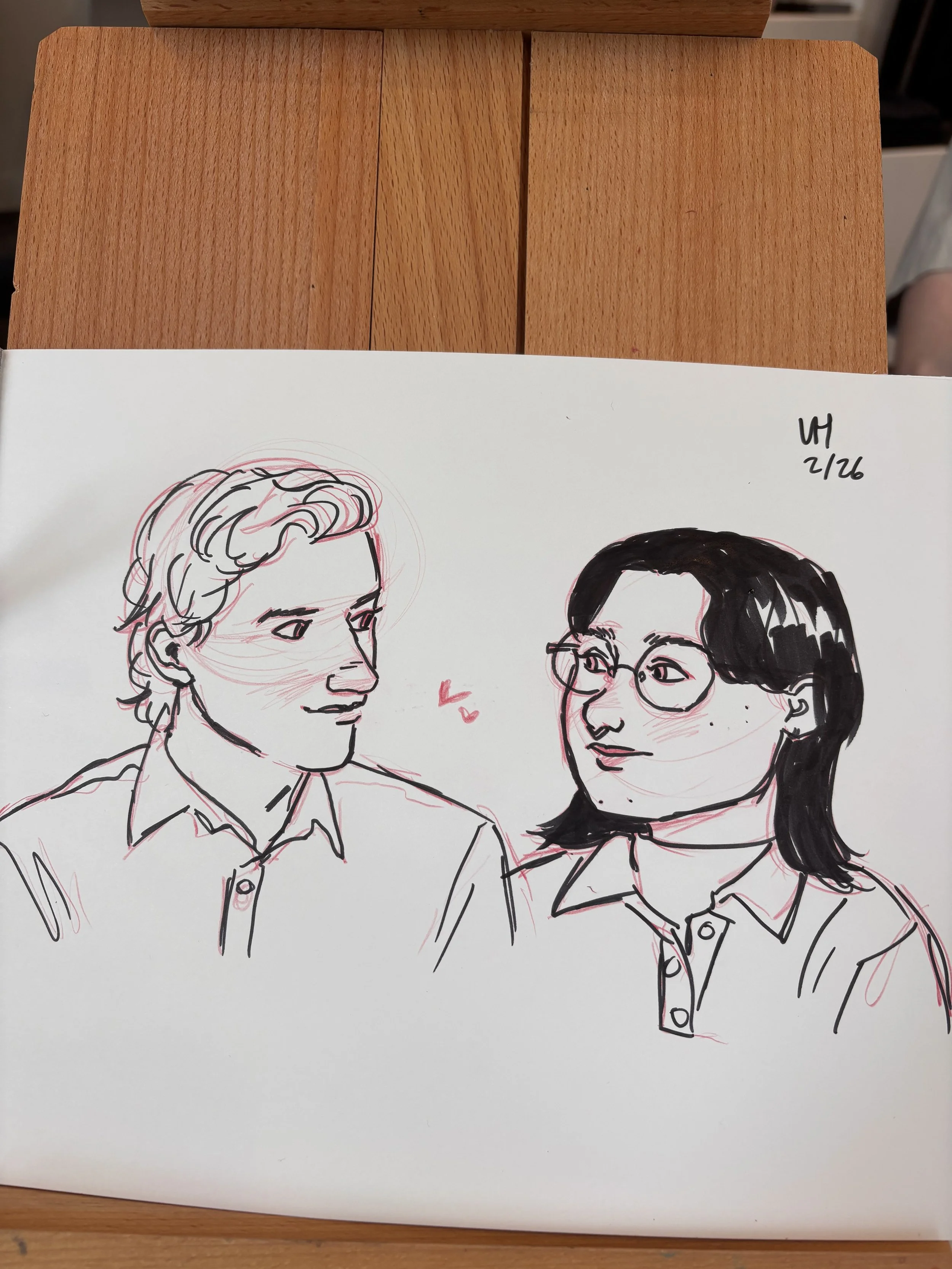 Drawing at a small business event, live portrait artist, pencil and ink art. Quick caricature sketch.