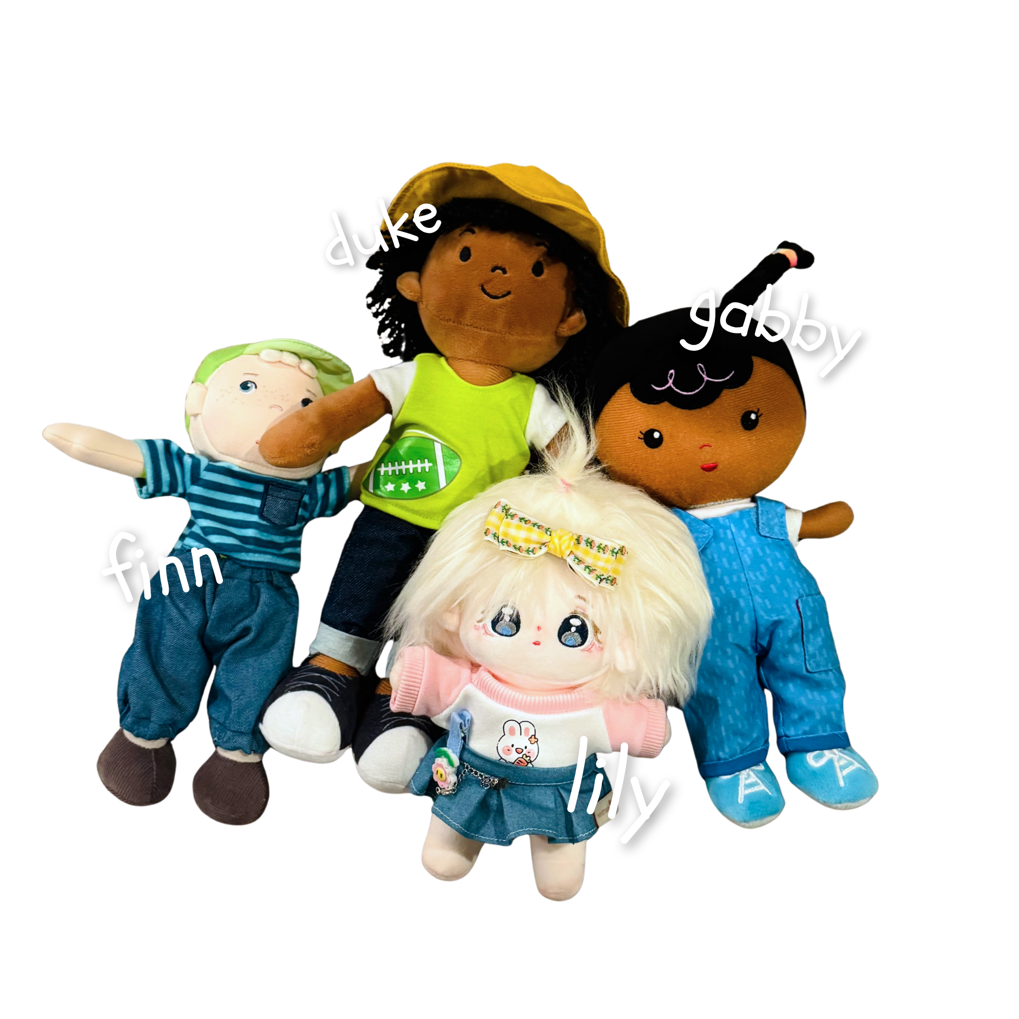 Group of plush toys and dolls, including a girl with black curly hair wearing a yellow hat, a doll with blonde hair and a green dress, and a girl with white hair wearing a pink shirt, with words like 'duke', 'baby', and 'finn' written across the image.