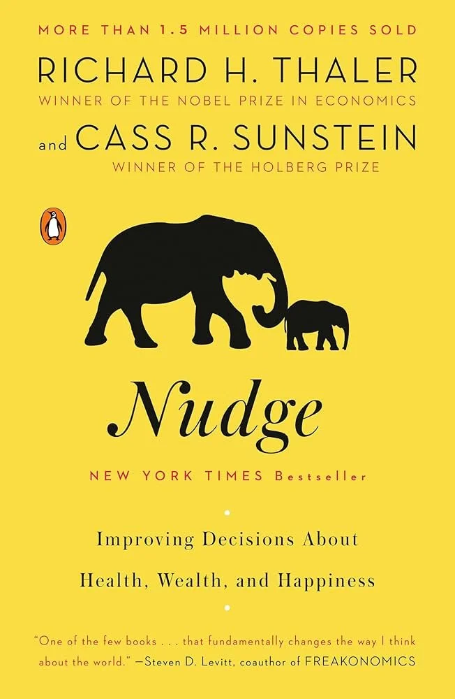Cover of the book "Nudge" by Richard H. Thaler and Cass R. Sunstein featuring a silhouette of two elephants on a yellow background with text about the authors and book details.