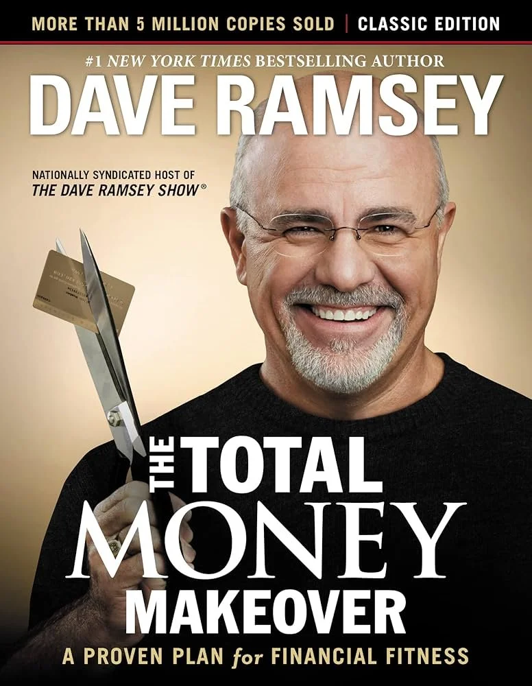 Book cover of 'The Total Money Makeover' by Dave Ramsey, featuring a smiling man holding a pair of scissors cutting a credit card with a gold background.