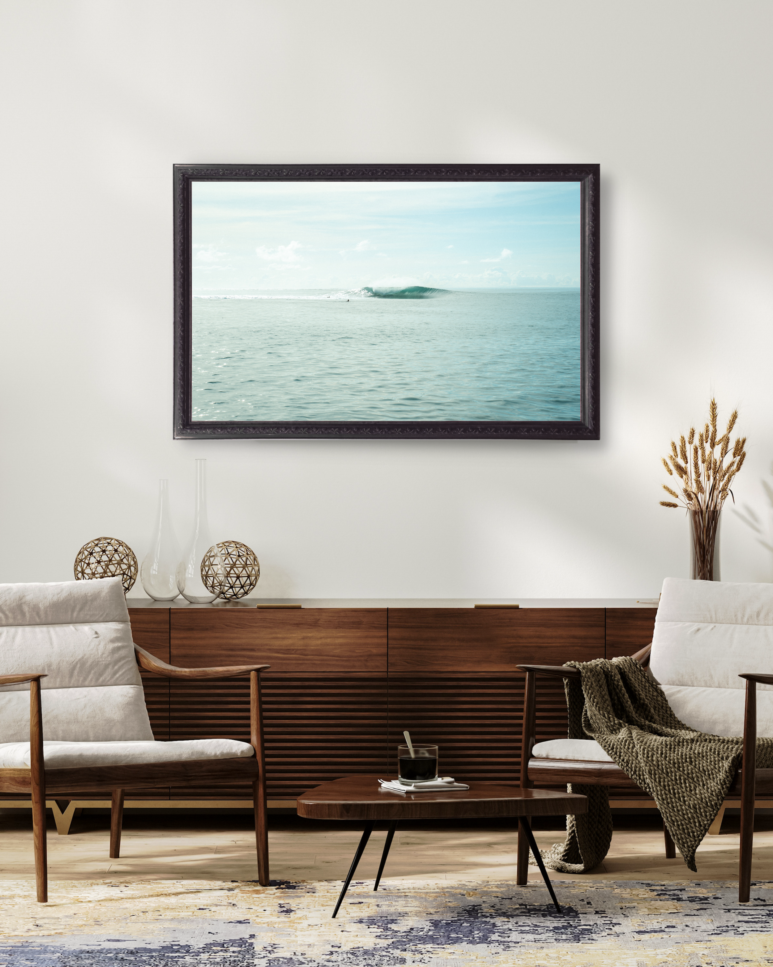 Modern living room with minimal ocean photography print of A-frame wave in Indonesia