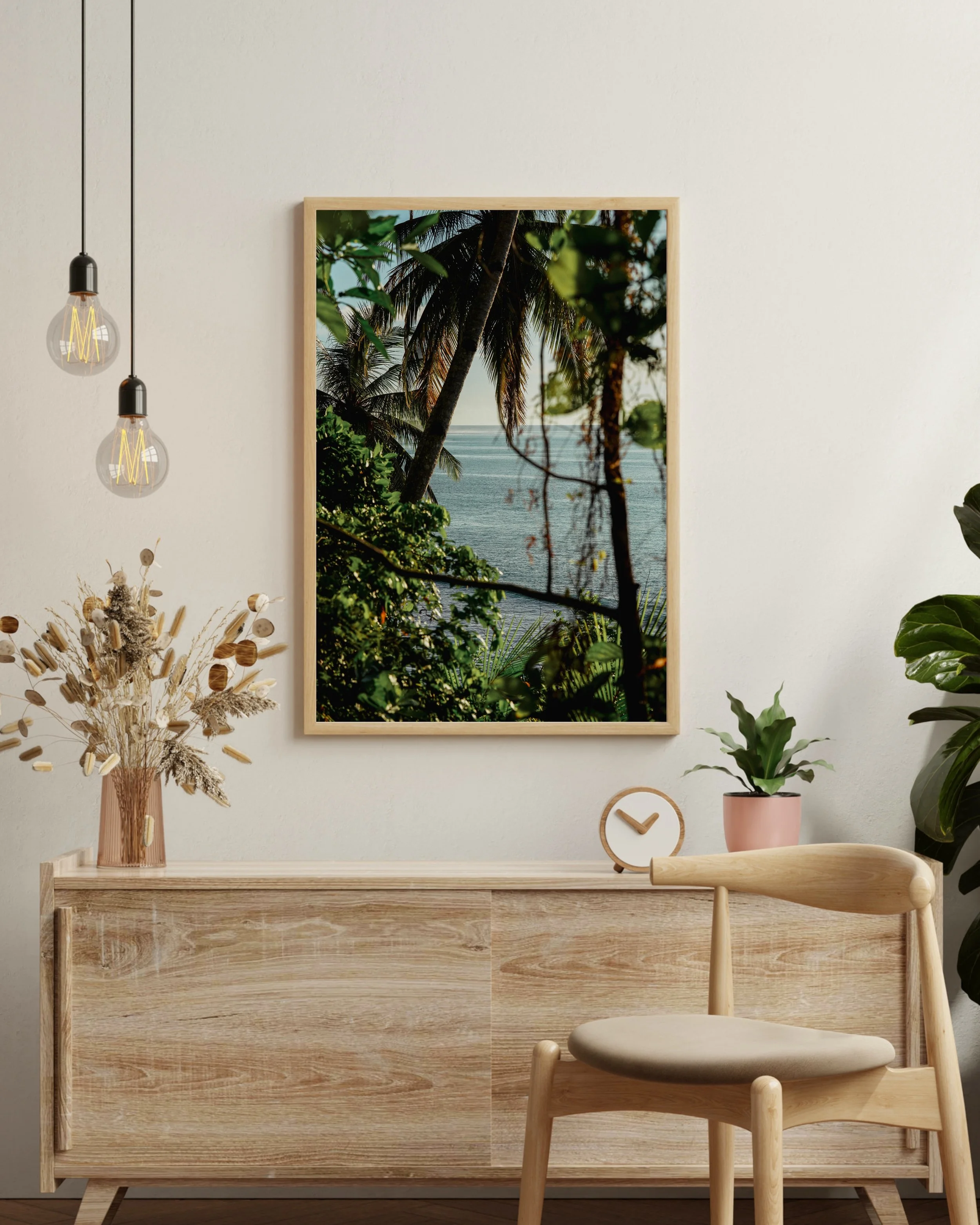 Modern living room with tropical ocean photography print framed by palm trees in the Mentawai Islands, Indonesia