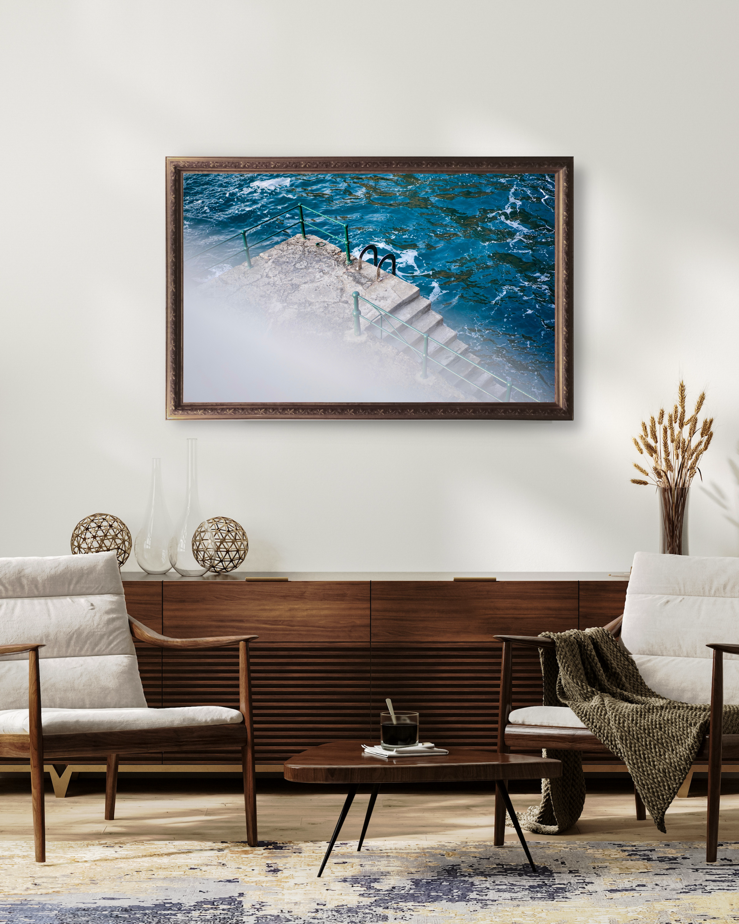 Minimalist coastal photography print of ocean steps leading into blue water living room decor