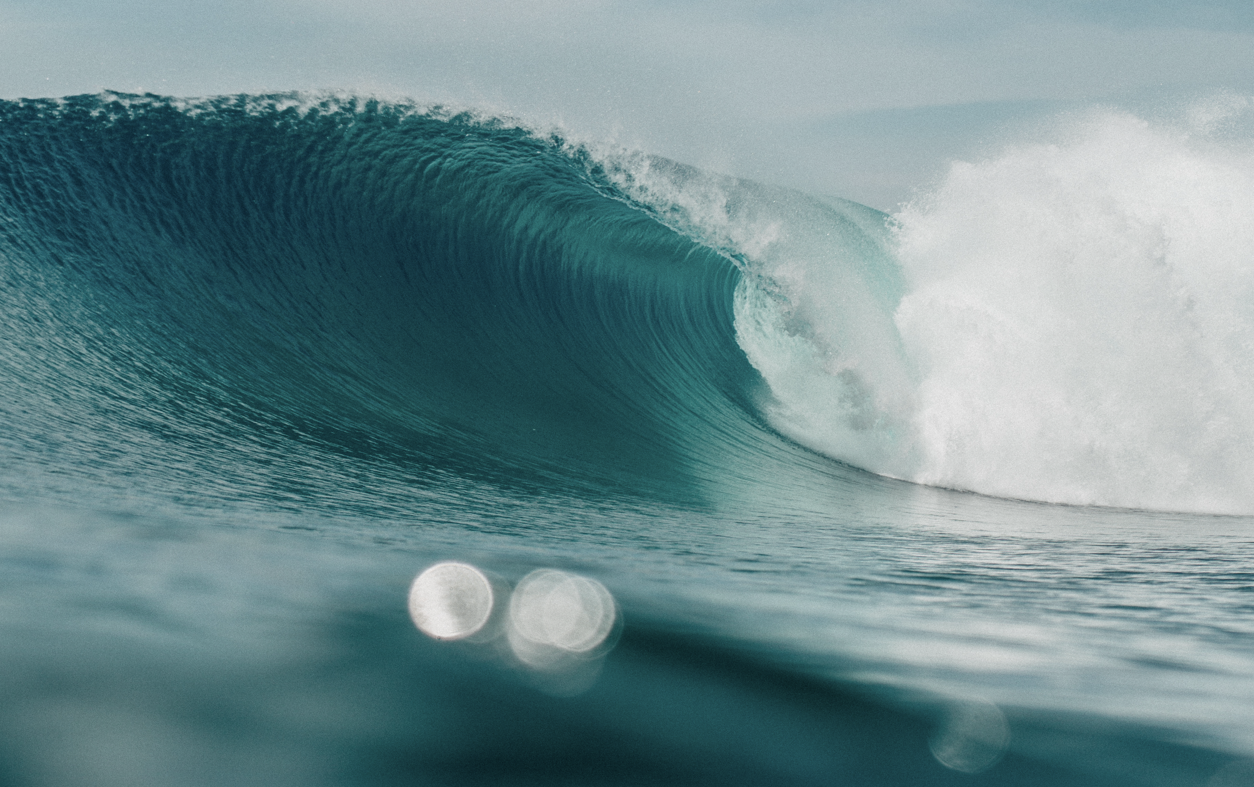 Fine art giclée surf photography print details of emerald green wave barrel captured in-water