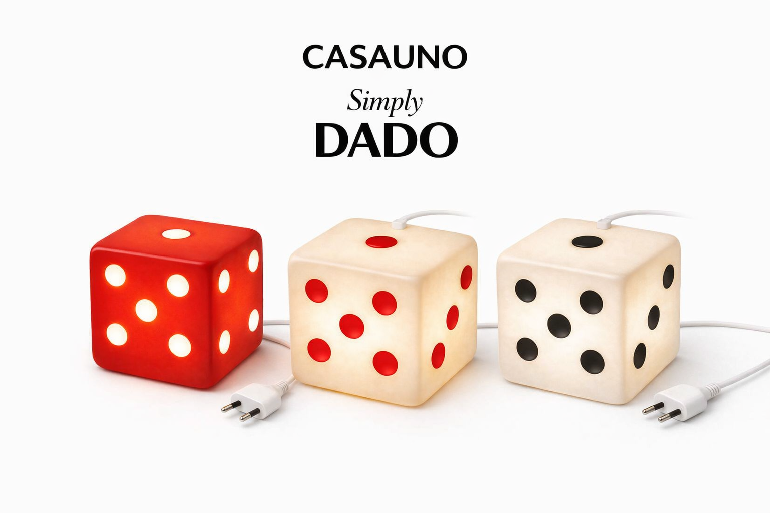 Three dice-shaped lamps with electrical cords, red, cream, and white with black and red dots, on a white background, with the text "CASAUNO Simply DADO" above.