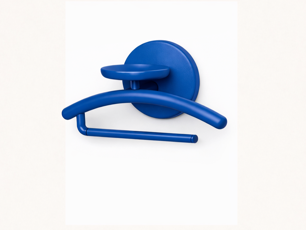 A blue modern wall hook with a round base, a curved hook, and an attachment arm, mounted on a white surface.