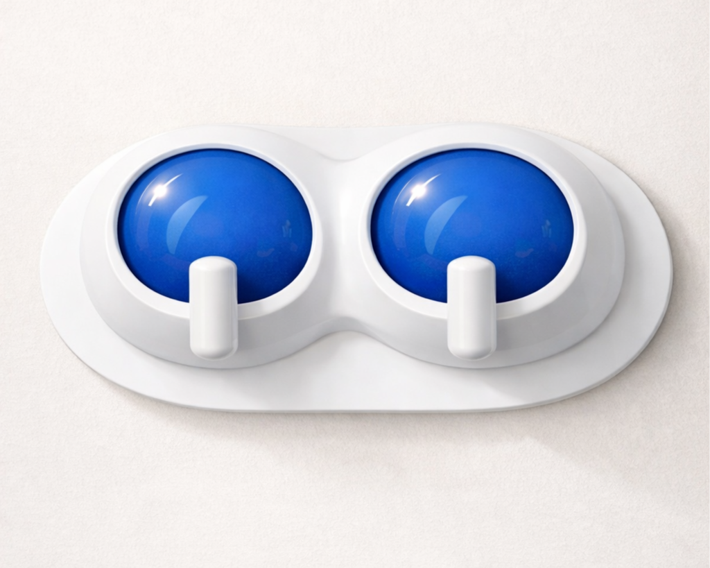 A wall-mounted dual nose and eye cover mask with two blue eye covers and white nose covers.
