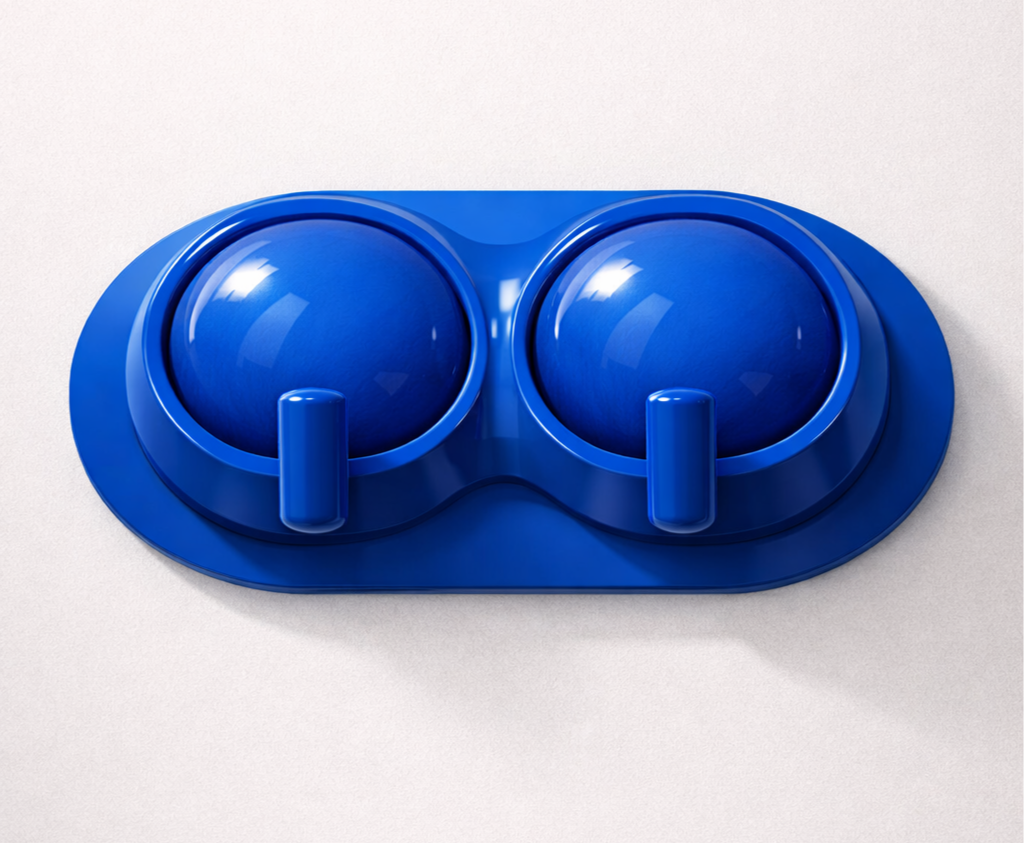 Close-up of a blue double power outlet with protective covers mounted on a white wall