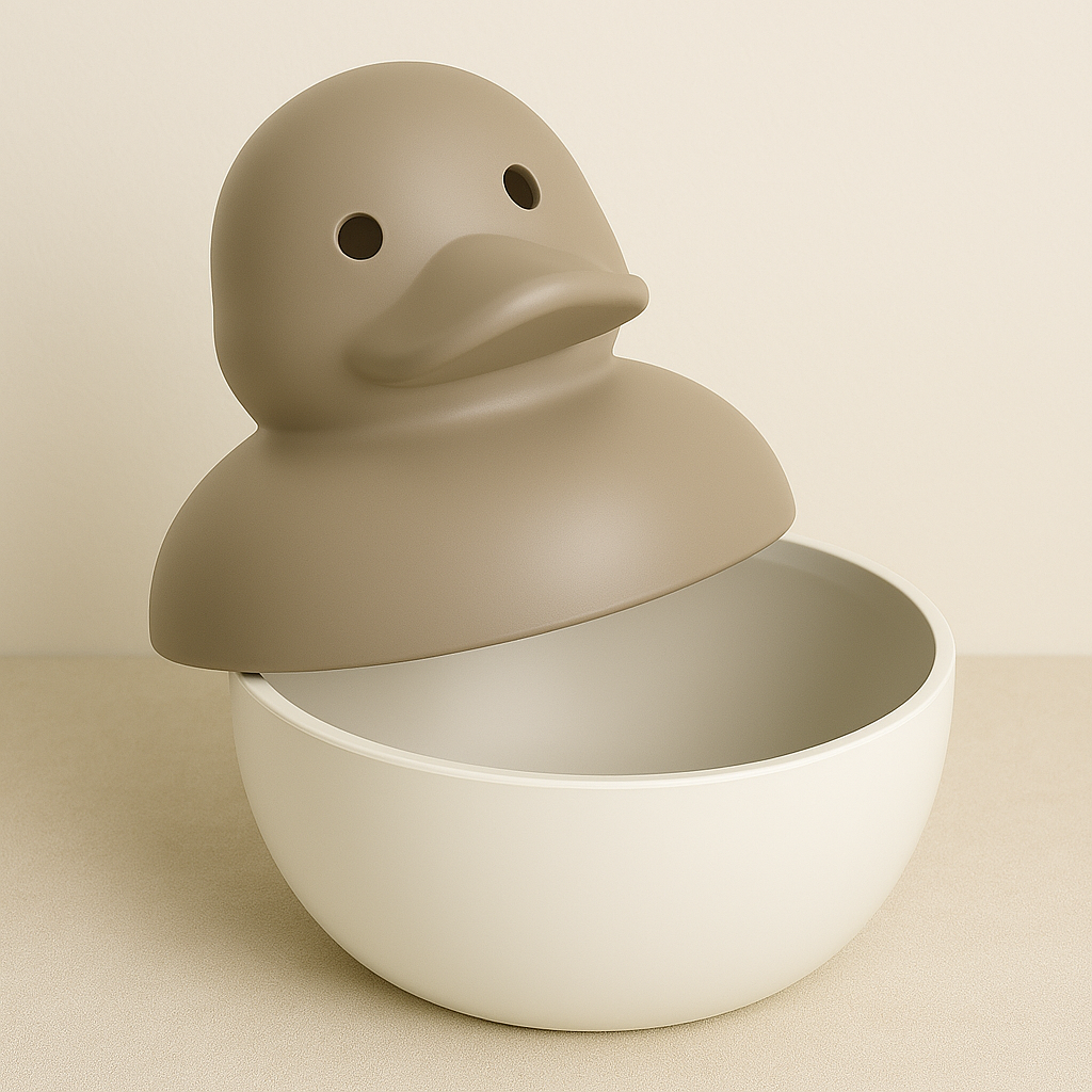 A decorative container shaped like a duck, with its head as a removable lid and the body as a bowl.