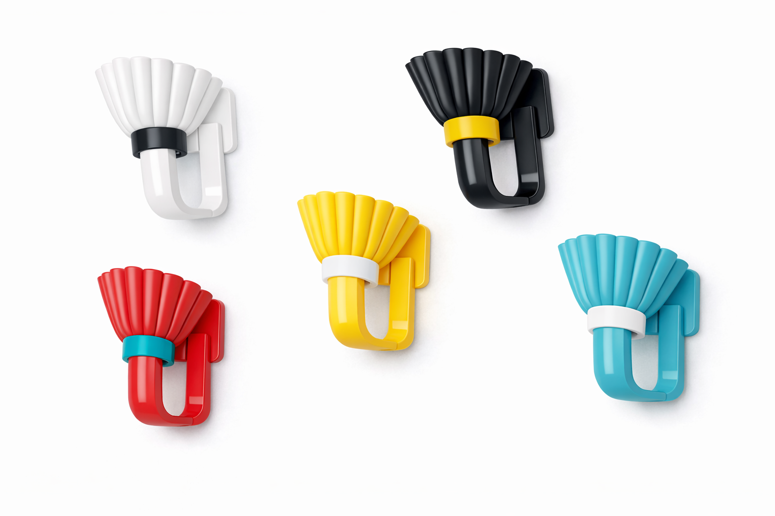 Five colorful wall hooks shaped like paper fans in black, white, red, yellow, and blue mounted on a white wall.