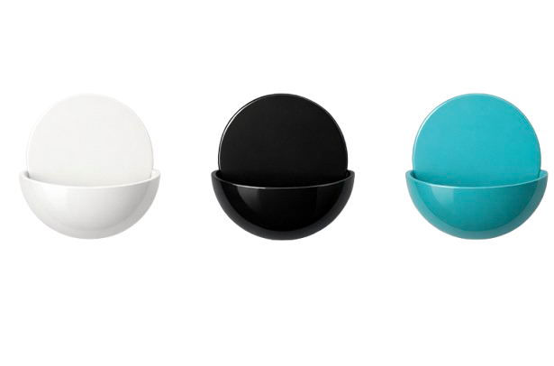 Set of three colorful bowls in white, black, and blue colors, arranged in a row.