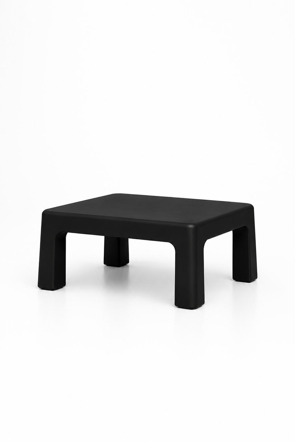 Black plastic low stool with four legs against a white background.