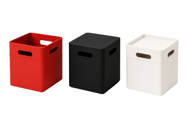 Three square storage baskets in red, black, and white with cutout handles.