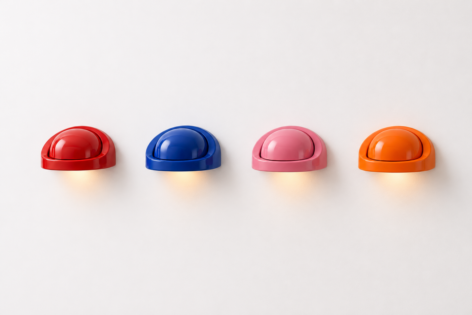 Four colorful wall-mounted light fixtures in red, blue, pink, and orange arranged in a row on a white wall.