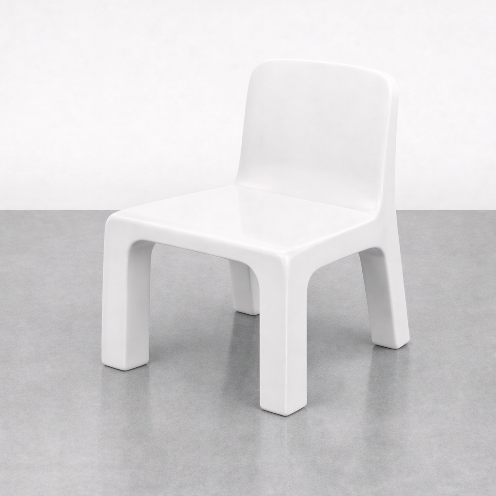 A white modern chair with thick legs and a slightly curved backrest, placed on a gray floor against a plain white background.