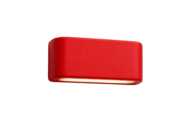 Red rectangular object with a rounded top and bottom edge, possibly a soap or a piece of packaging.