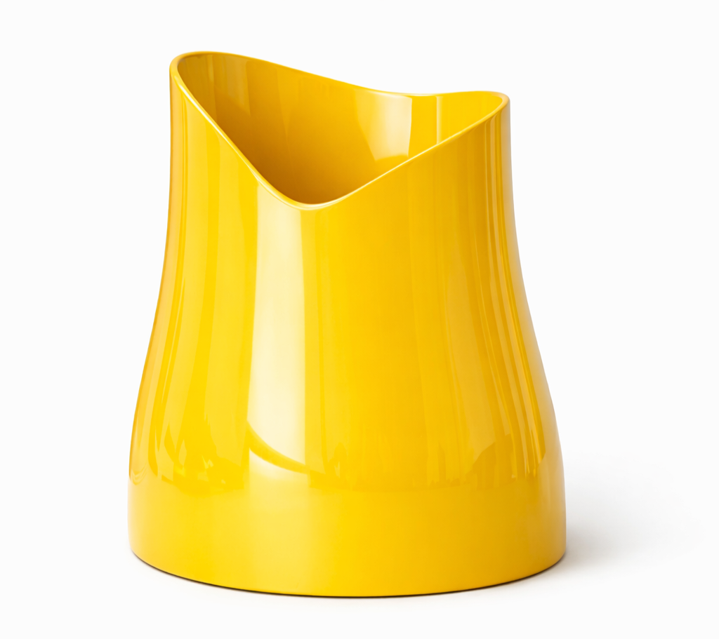 A yellow, modern, sculptural vase with a curved, asymmetrical opening.