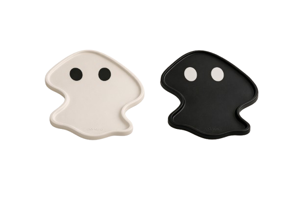 Two ghost-shaped objects, one white with black eyes and one black with white eyes, resembling Pac-Man characters.
