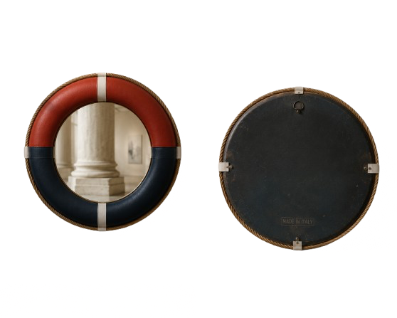 Two round wall decorations resembling life preservers, one with orange and navy blue stripes facing forward, the other with a plain black face showing the back.