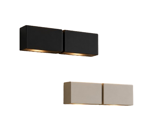 Two pairs of rectangular wall-mounted speakers, one black and one white, on a white wall.
