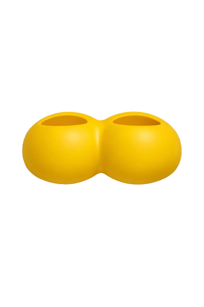 A pair of yellow silicone shoes with two holes on top, placed beside each other.
