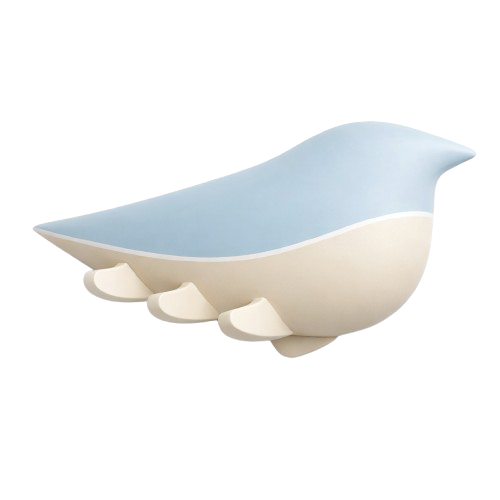 A mug shaped like a stylized whale with a blue upper body and white lower body.