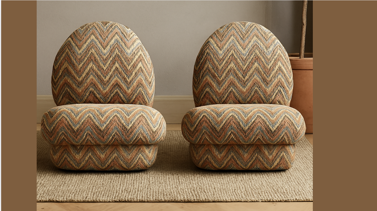 Two upholstered chairs with zigzag patterned fabric in earth tones, placed on a beige carpet in front of a light gray wall, with a large clay pot container and a potted plant on the right side.