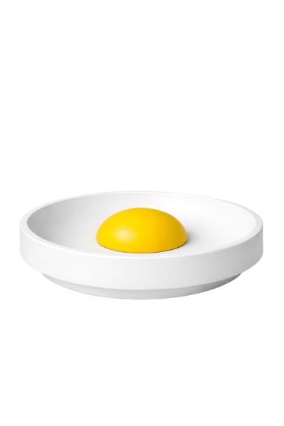 A white plate with a yellow, dome-shaped object in the center, and distorted black text above and below the plate.