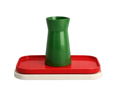 A green watering can on a red and white rectangular tray.
