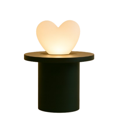 A heart-shaped light on a pedestal against a bright yellow background.