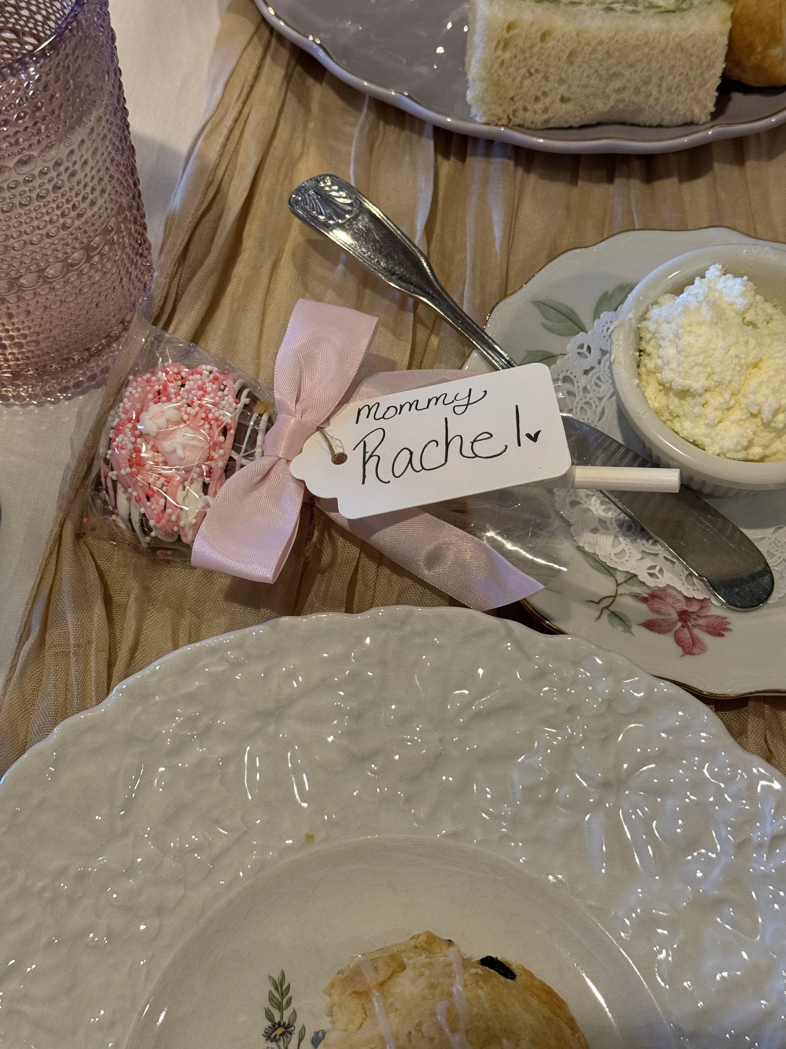 Personalized pink chocolate-dipped Oreo favor from Hoffman’s Chocolates, whipped butter and a scone at a baby shower luncheon at Teapots & Treasures Café in Juno Beach, Florida.