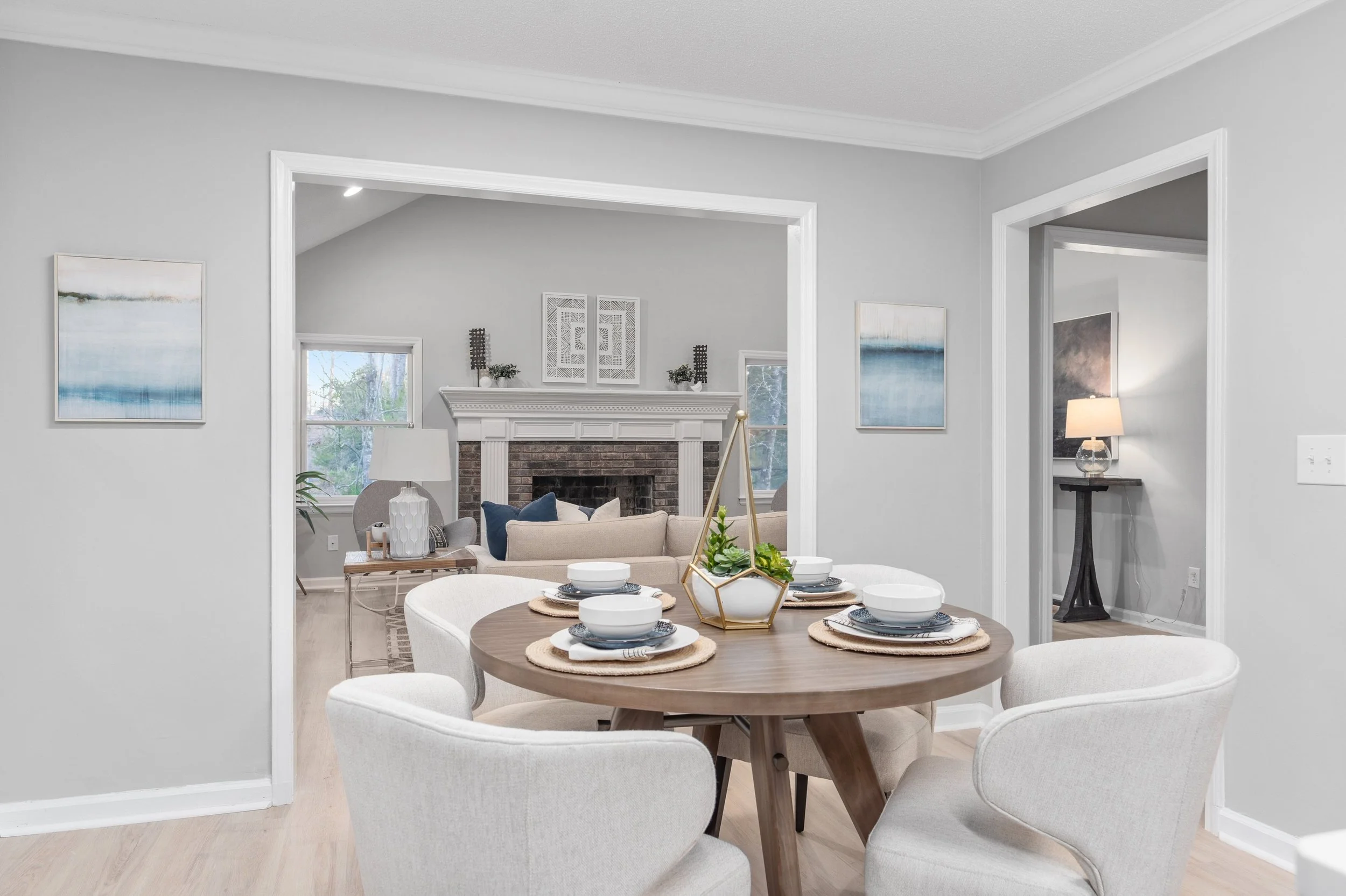 coastal dining room staged to help buyers visualize traffic pattern