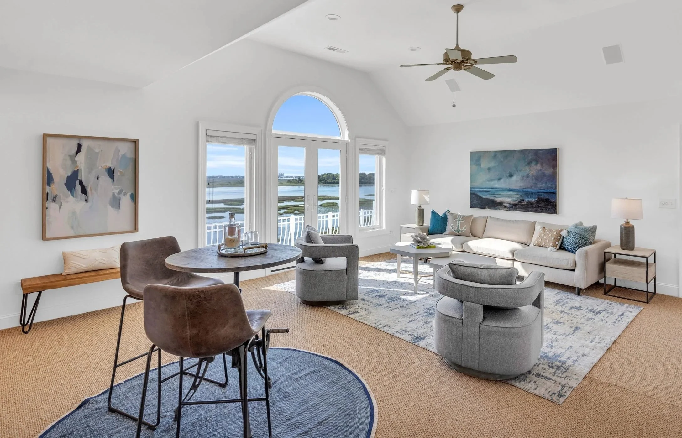 Professionally staged large bonus room with defined seating areas