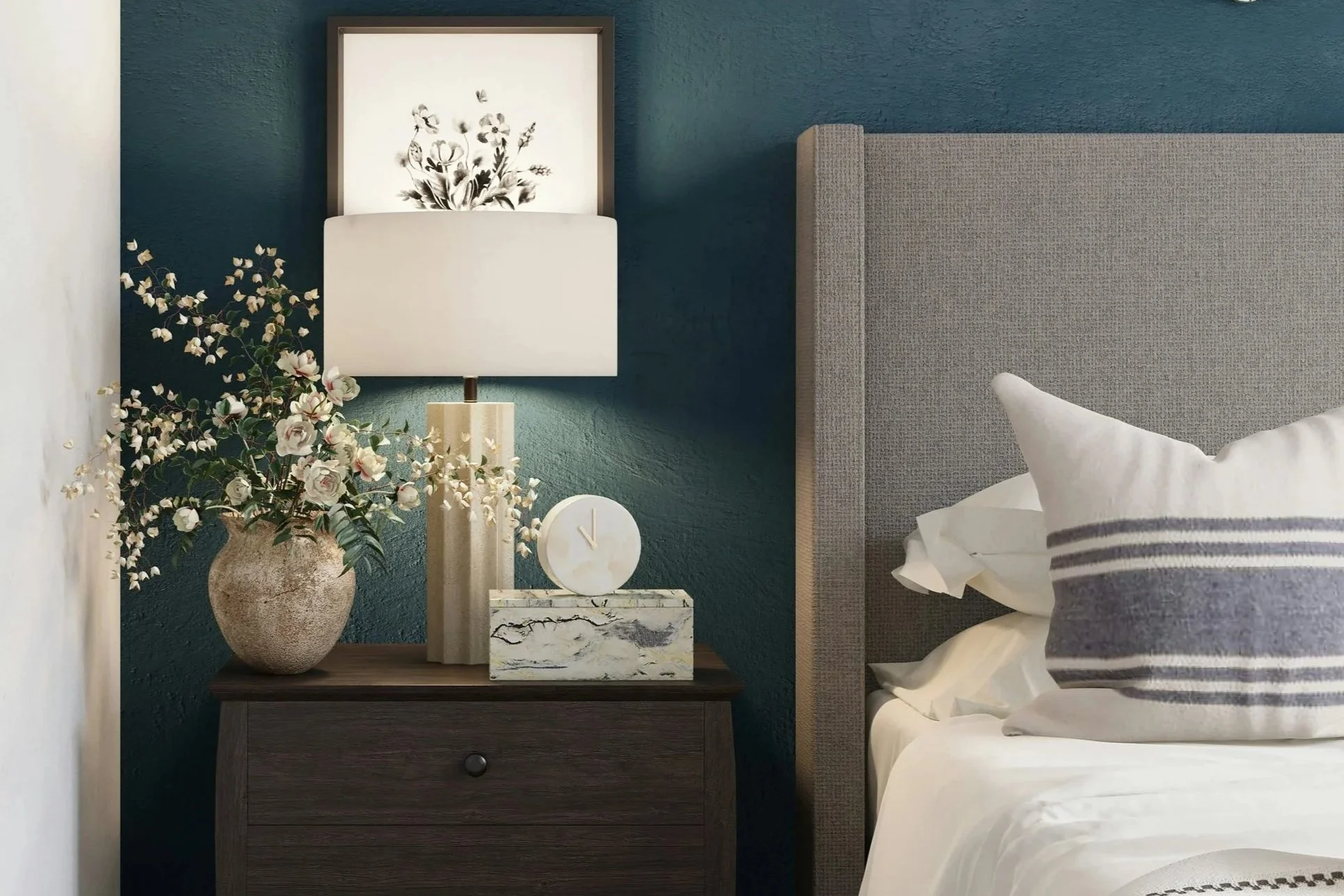 Styled console table with decorative objects, books, greenery and neutral home accessories