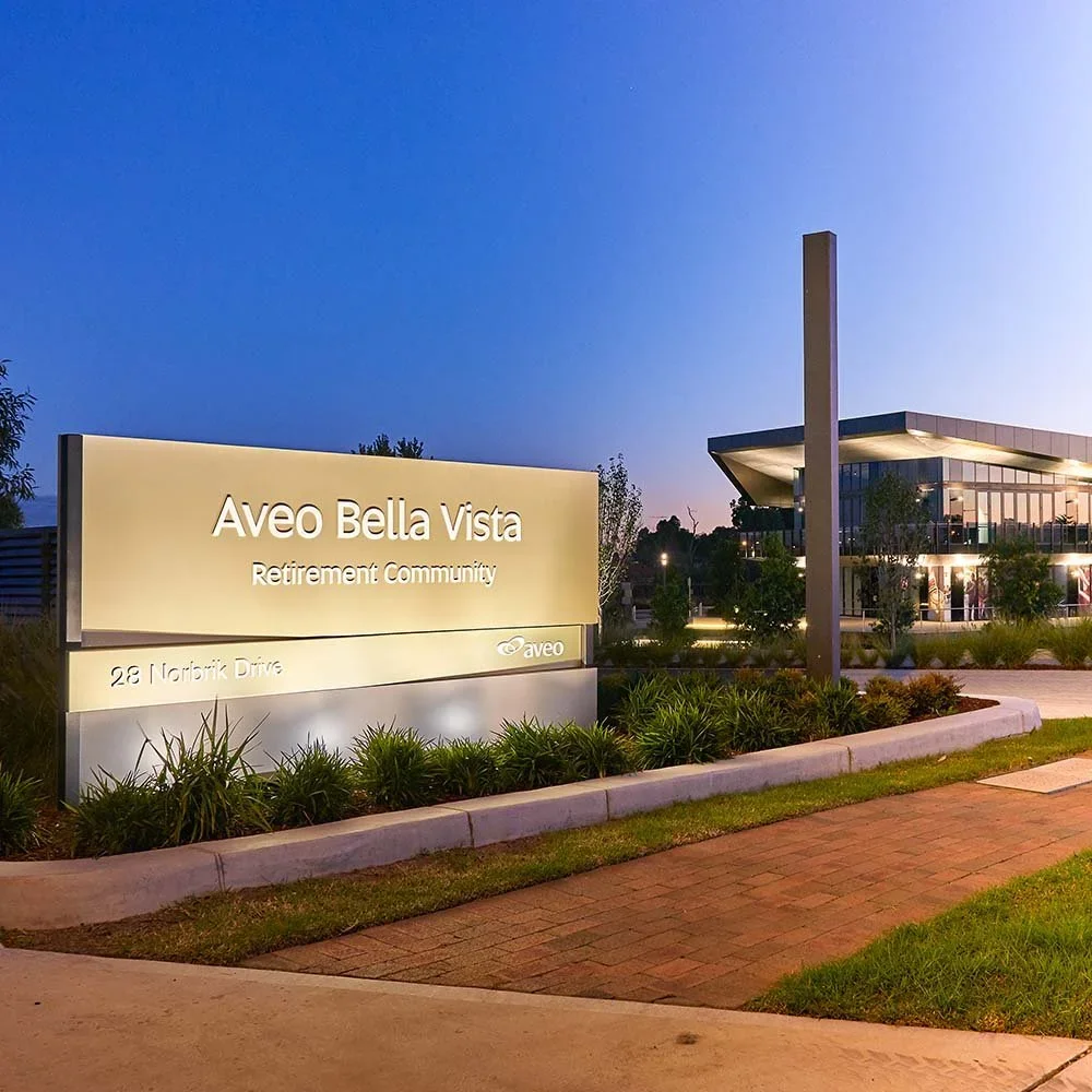 aveo-bella-vista-flood-lit-entry-sign.webp