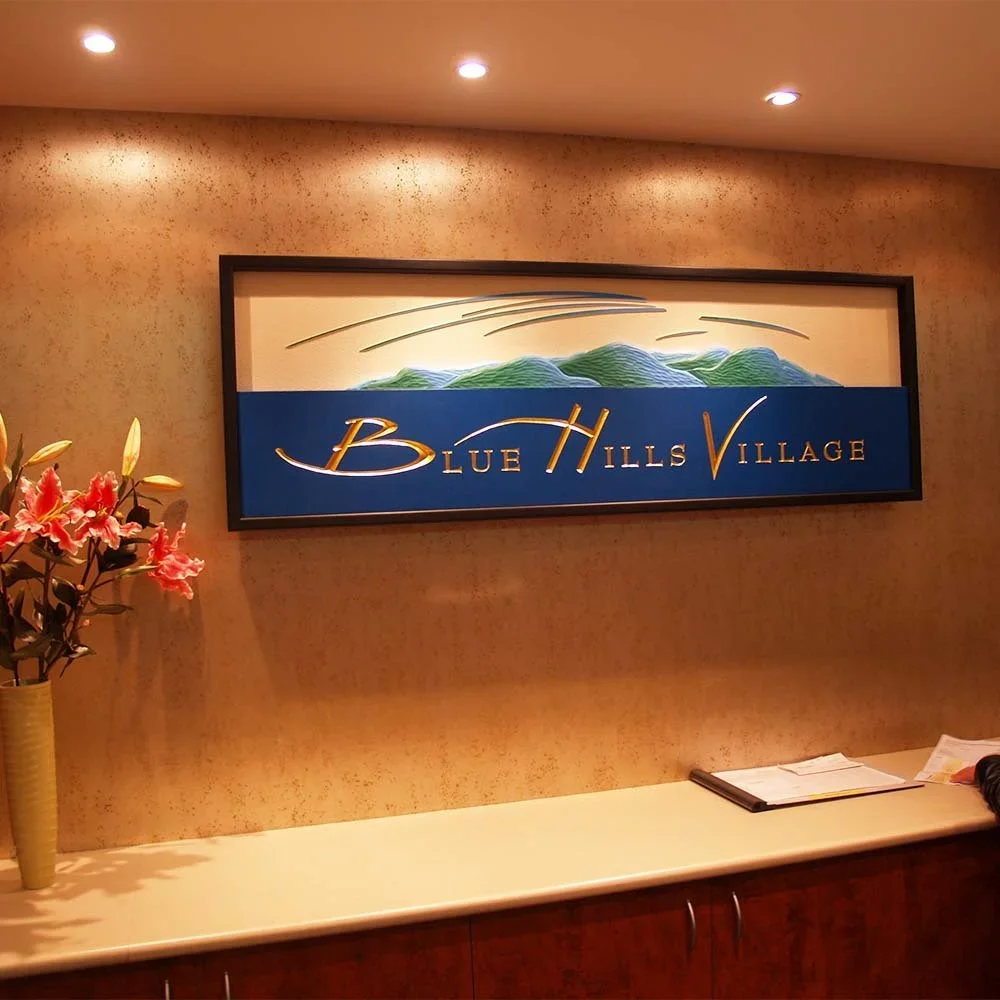 blue-hills-village-reception-retirment-village-wall-sign.webp