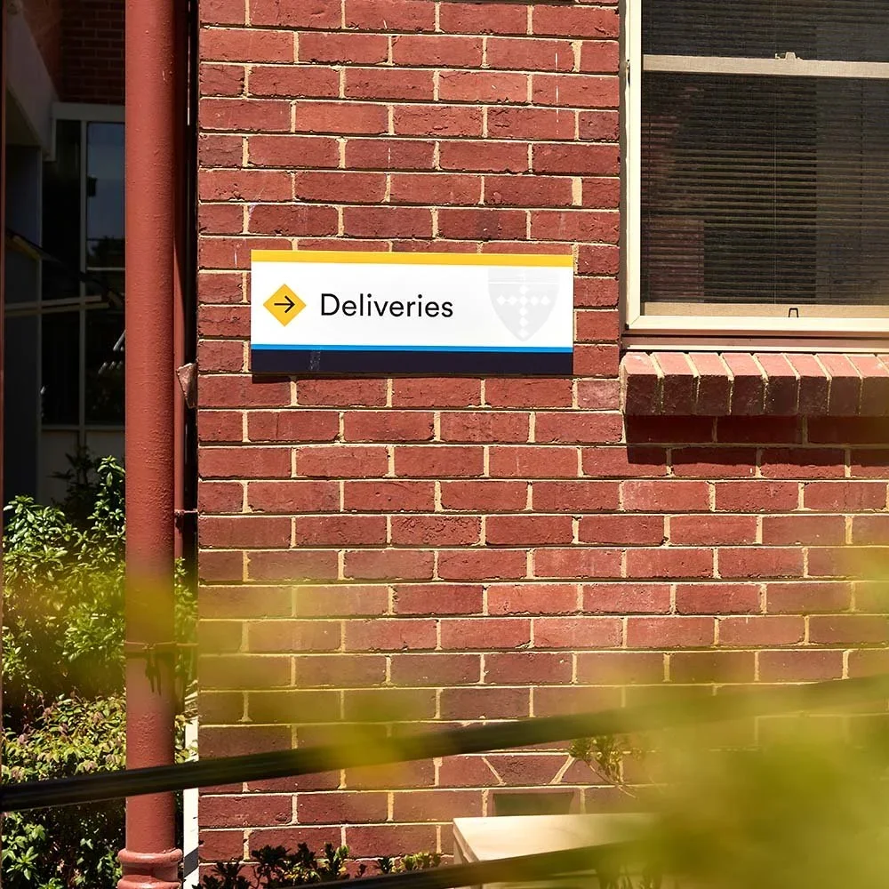 killester-college-springvale-deliveries-directional-sign.webp