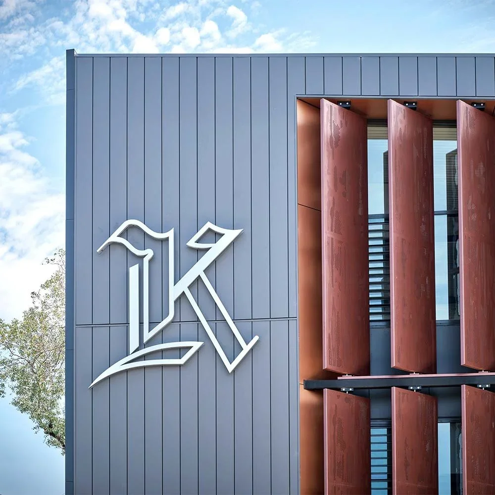 kilvington-grammar-school-science-centre-illuminated-k-sign.webp