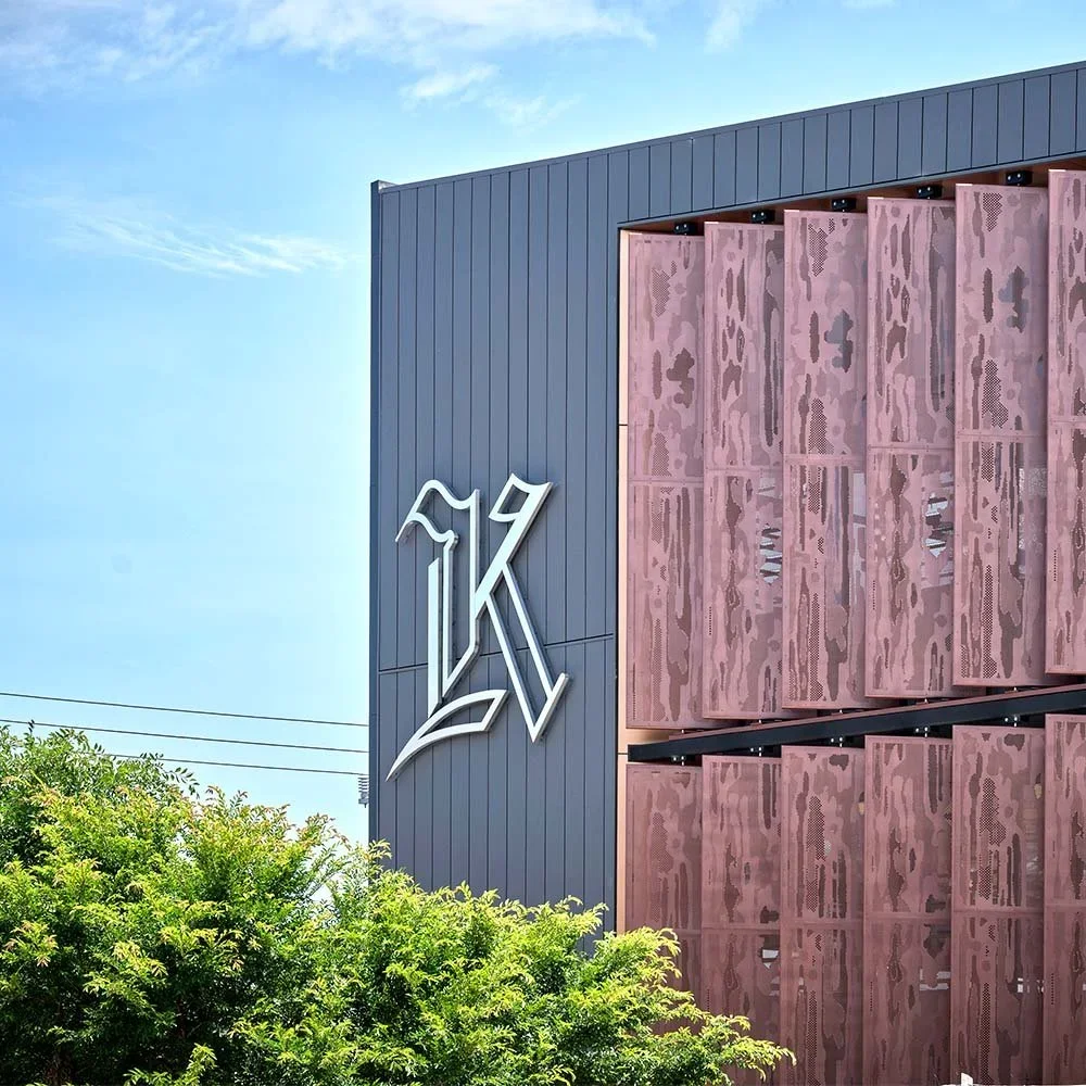kilvington-grammar-school-the-hive-wall-mounted-stainless-steel-k-sign.webp