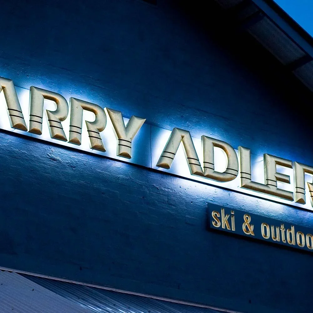 larry-adler-illuminated-gilded-letter-signage.webp