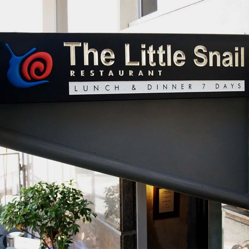 the-little-snail-french-restaurant-fascia-sign.webp