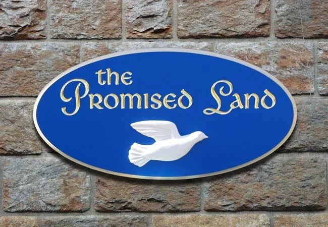 promised-land-house-sign-2.webp