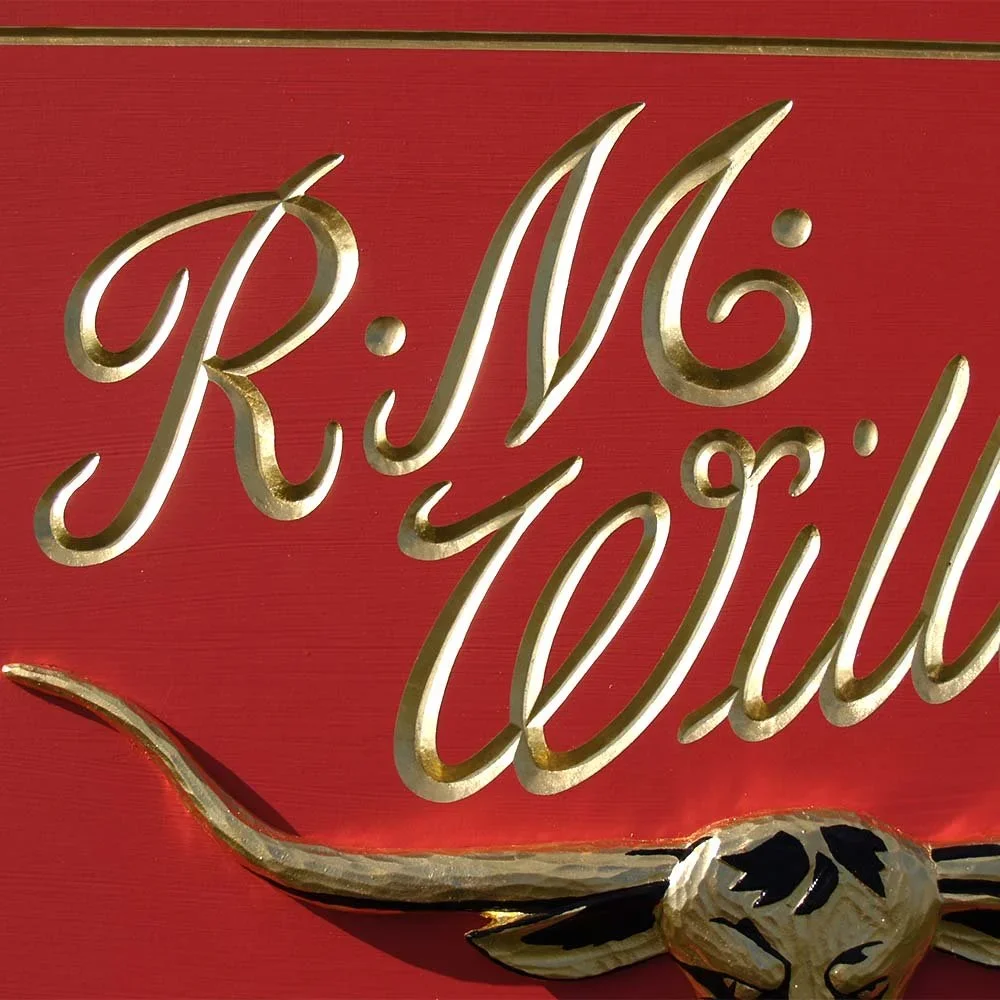rm-williams-bush-outfitter-red-and-gold-business-signs.webp