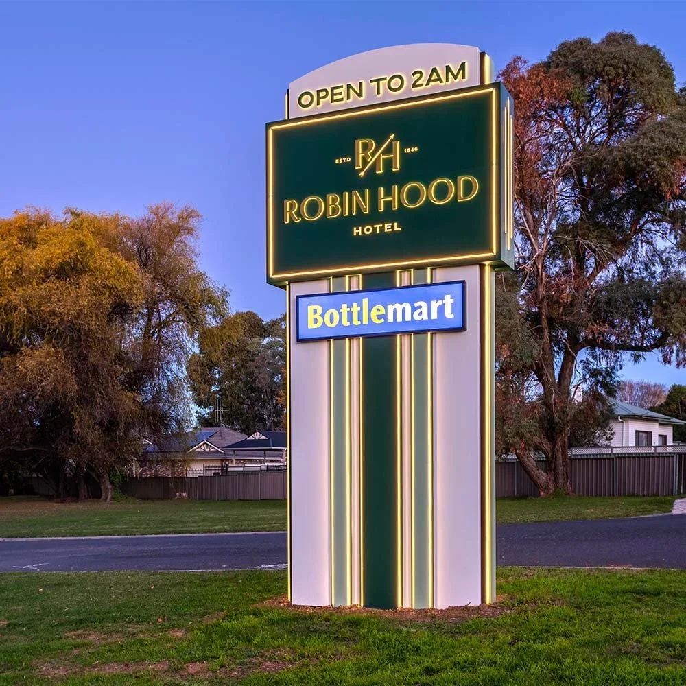 robin-hood-hotel-illuminated-branding-pylon-sign-evening.webp