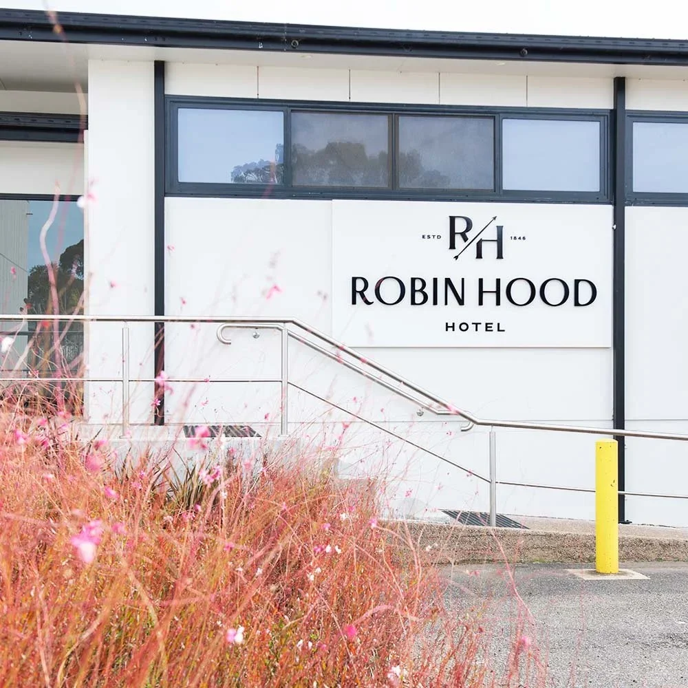 robin-hood-hotel-orange-corporate-entrance-wall-signage.webp