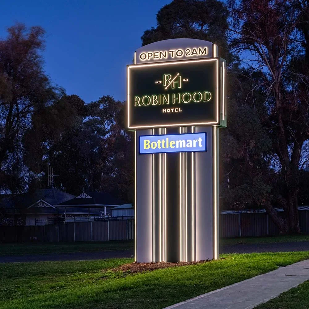 robin-hood-hotel-orange-pinstripe-illuminated-fabricated-light-box-pylon-sign.webp