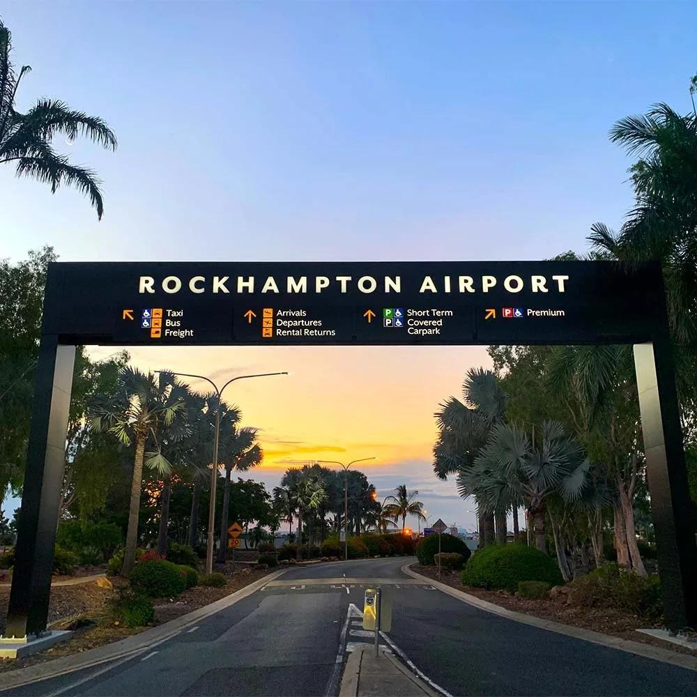 rockhampton-airport-entry-way-directional-gantry-over-road-sign.webp