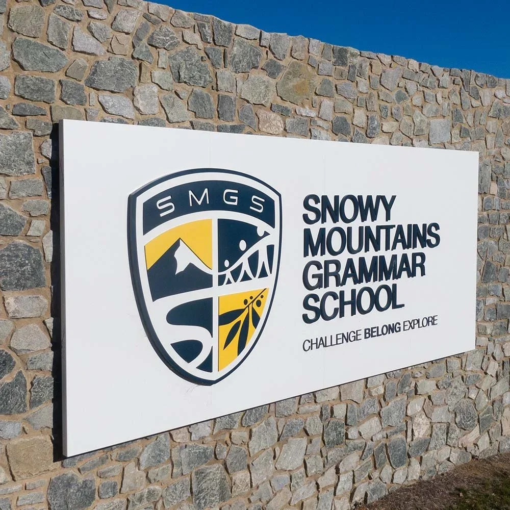 snowy-mountains-grammar-school-detail-of-entry-sign.webp