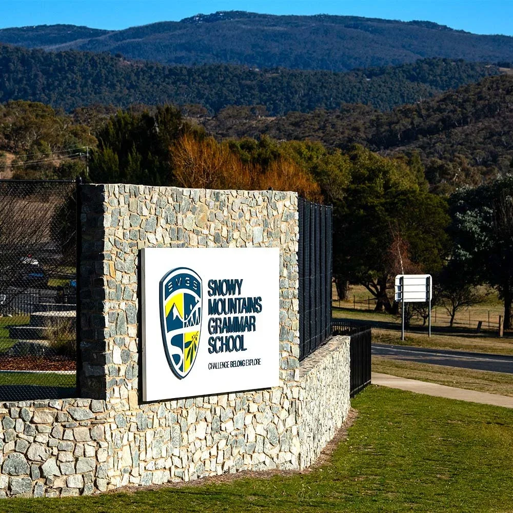 snowy-mountains-grammar-school-wall-branding-sign.webp